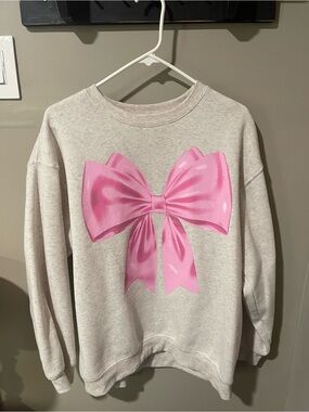 Women’s Cream Sweatshirt with Pink Bow Graphic